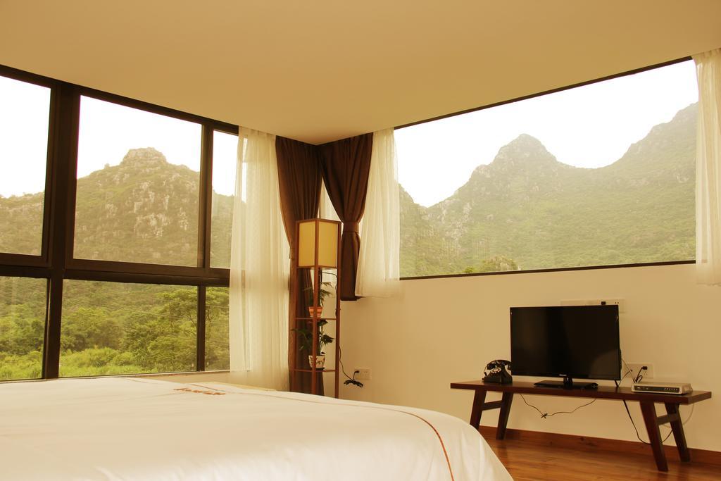 The Flower Hotel Guilin Værelse billede