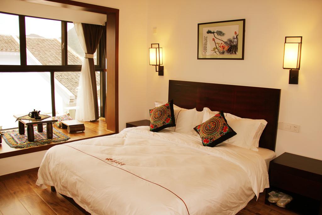 The Flower Hotel Guilin Værelse billede