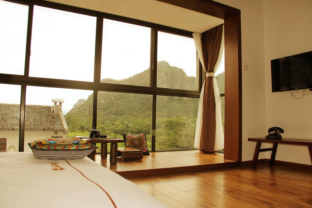 The Flower Hotel Guilin Værelse billede